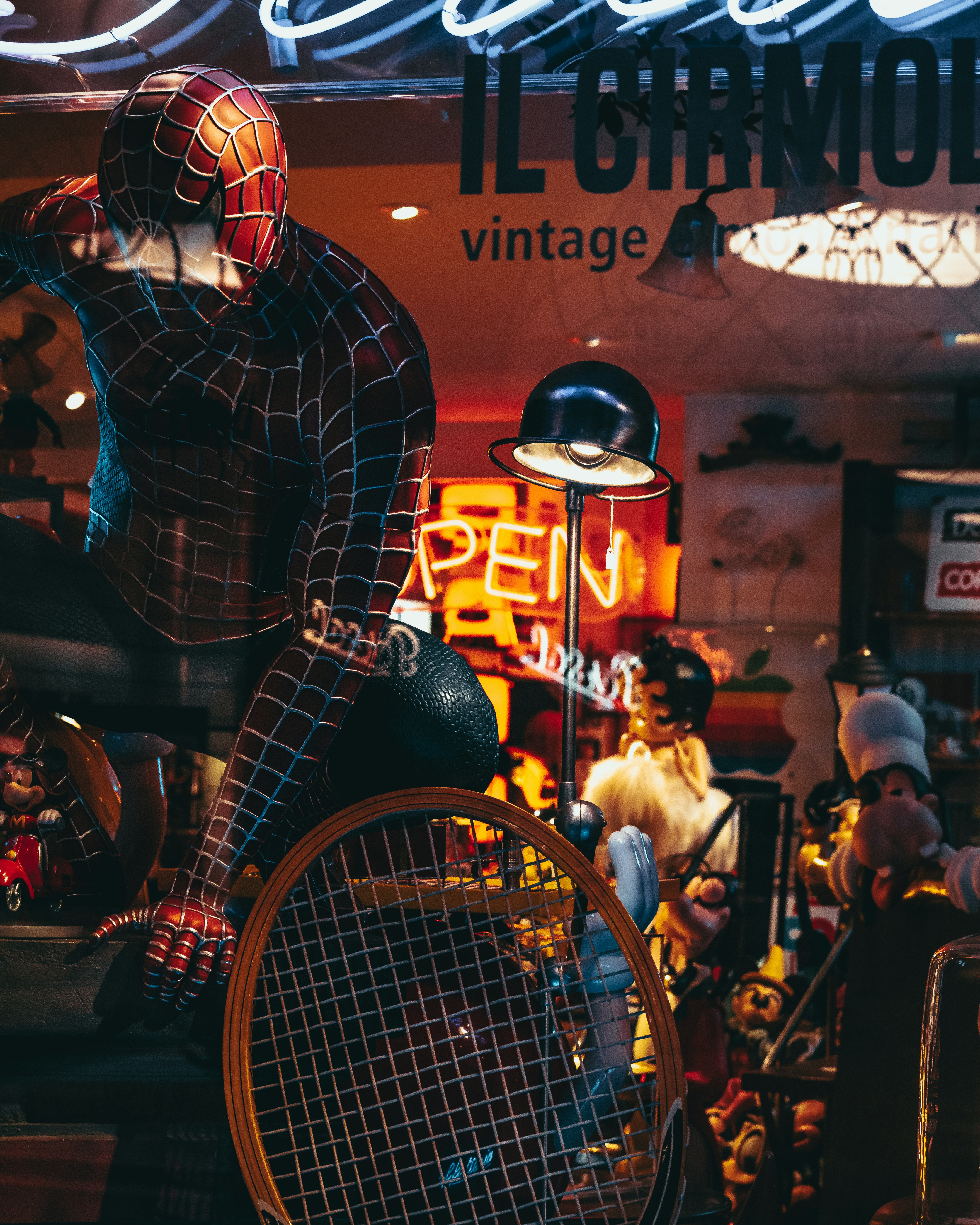 man in black and white checkered long sleeve shirt and blue denim jeans sitting on red